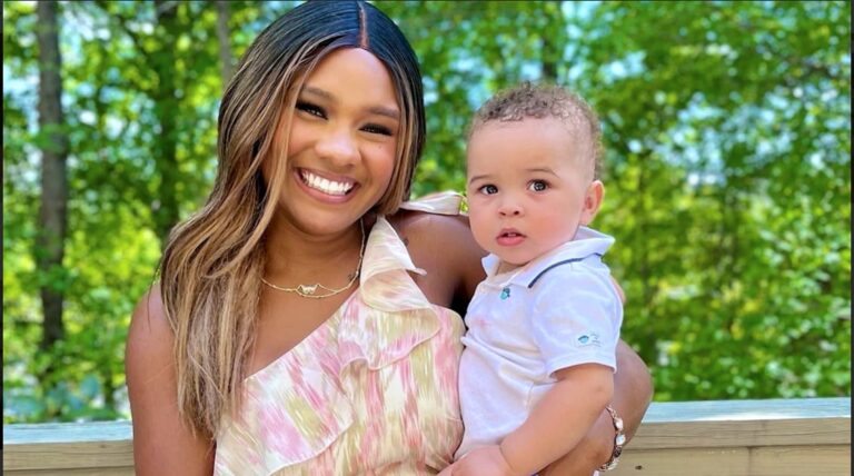 Young Black mother holding her baby son